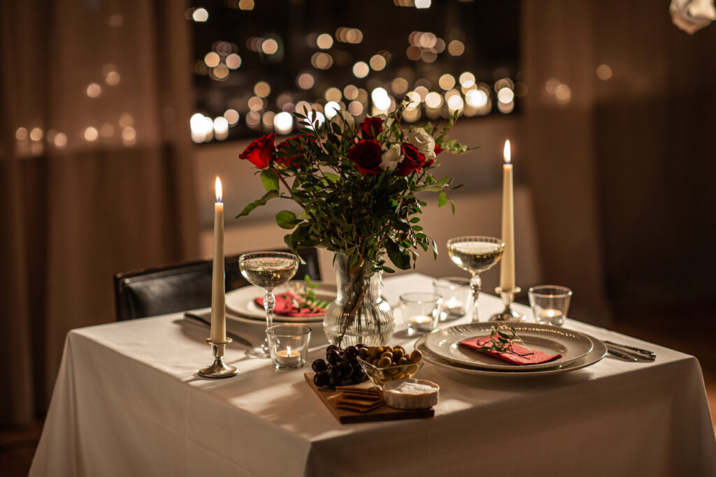 A romantic table for two at home for a candlelit dinner