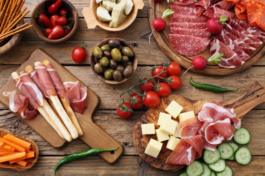 A plate of cold different cold foods and cheeses for aperitivo
