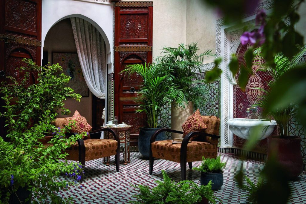 An elegant Moroccan courtyard with intricate tilework, at Royal Mansour in Marrakech, a romantic getaway in Africa.