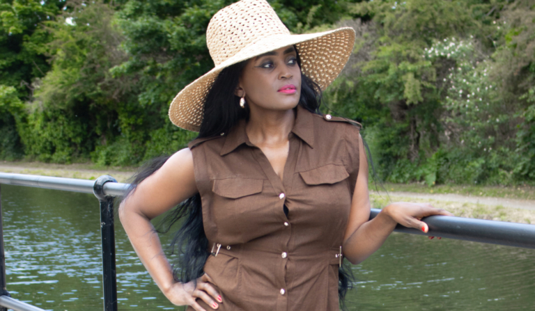 How to accessorise an outfit: An elegant woman in a wide-brim hat, showcasing a perfect accessory choice