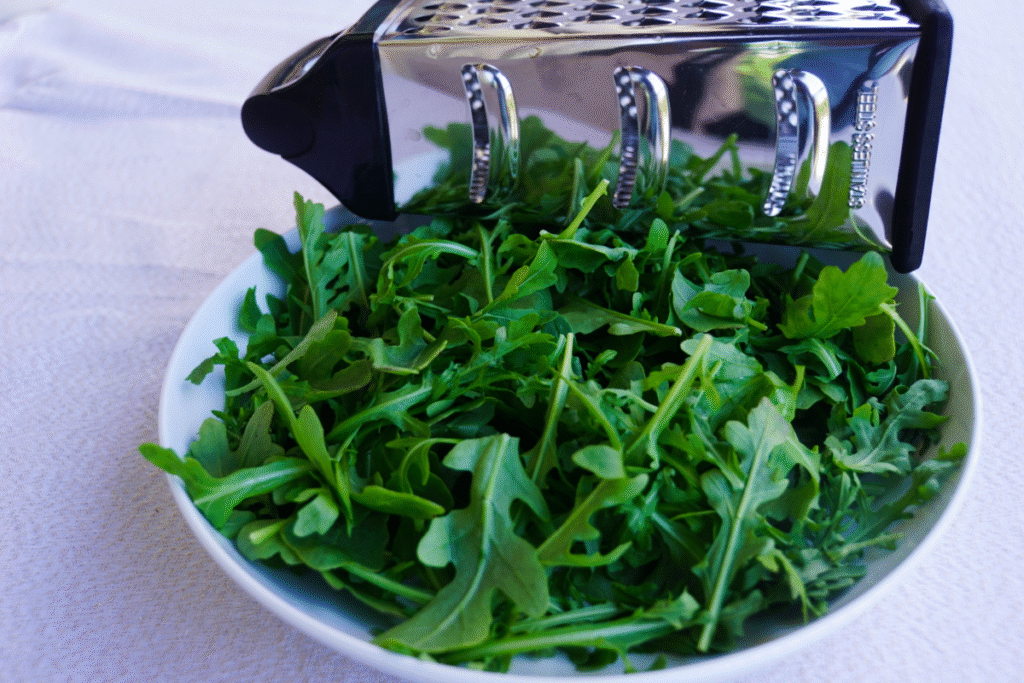 Rocket leaves on a white wide bowl
