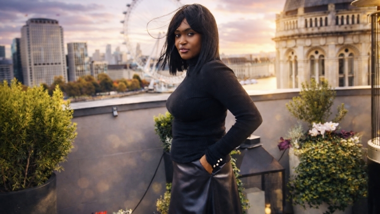 Word of the year growth — a reflective portrait of Nillah on a London rooftop at sunset, symbolising intention and personal growth.