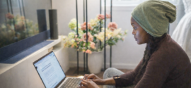 Woman working on a laptop at home, reflecting on a career change at 40